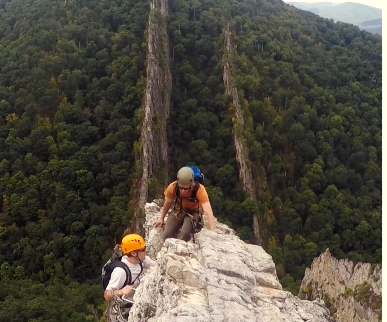 Via ferrata climber on an exposed wall